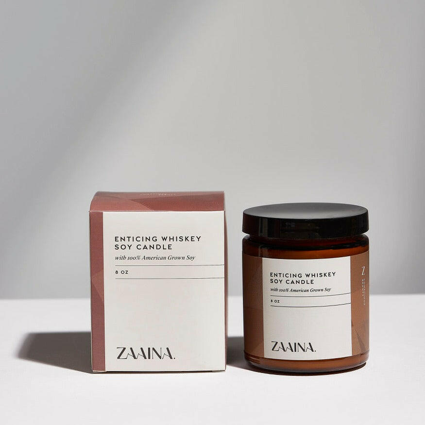 Hand-poured Whiskey Soy Candle creating cozy vibes, perfect for a relaxing and aromatic home ambiance.