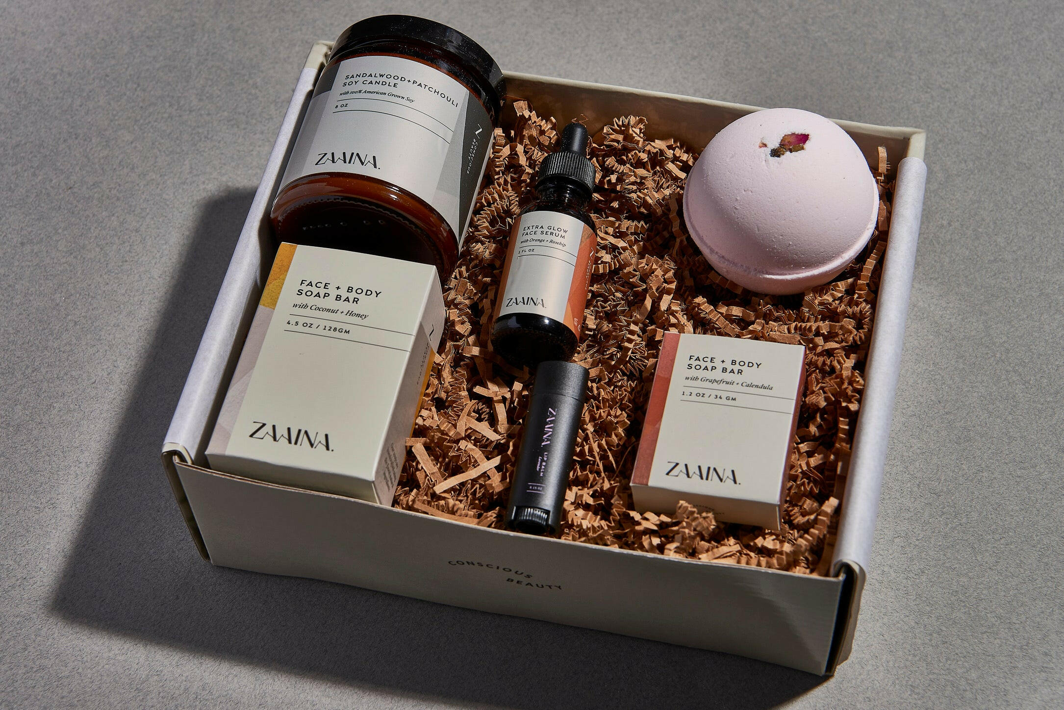Luxury spa box featuring rose and sandalwood essentials for relaxation, perfect gift set for wellness enthusiasts.