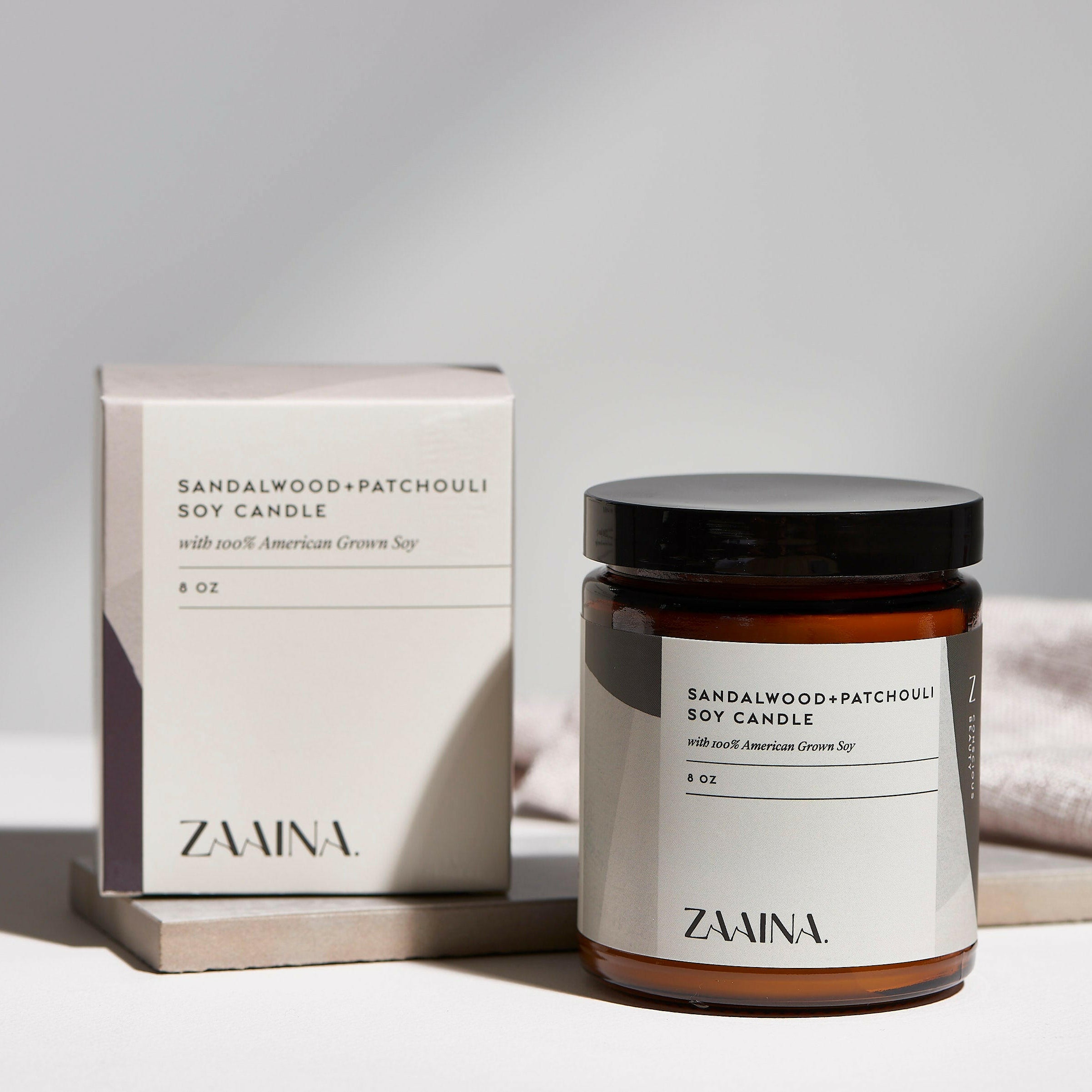 Premium Sandalwood soy candle in glass jar, eco-friendly and long-lasting fragrance for home decor.