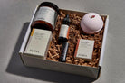 Luxury spa box featuring rose and sandalwood essentials for relaxation, perfect gift set for wellness enthusiasts.
